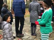 Elf with child waiting for Santa